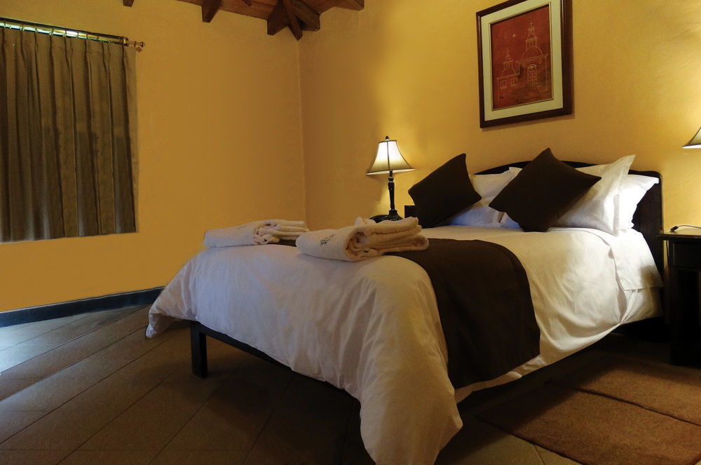 Termas De ปาปาญัคตา ภายนอก รูปภาพ A bedroom at the hotel